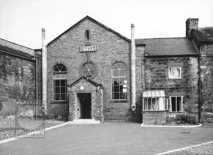 Hemsworth Library, Market Street, Hemsworth A black and white photograph of Hemsworth Library, Market Street, opposite the Kings Head public house, Hemsworth. The library was converted from a chapel in 1953, retaining the original facade, roofed entranceway and windows.