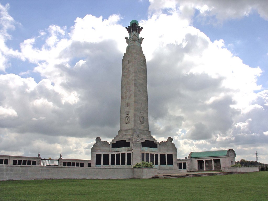 A high column with panels at the bottom of it.