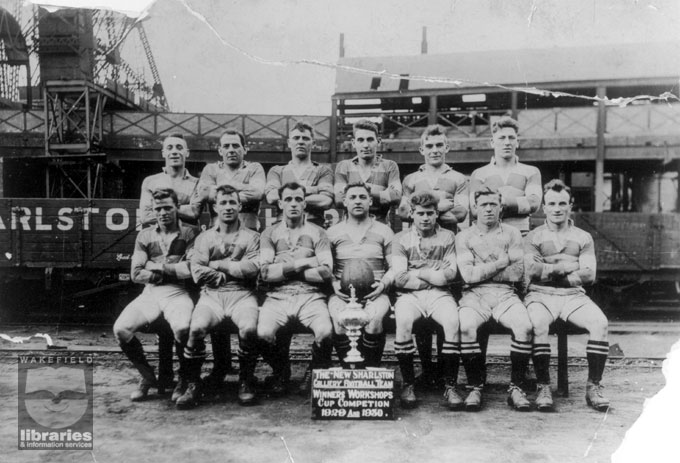 A black and white photograph of the New Sharlston Colliery football team, winners of the Workshop Cup Competition 1929 to 1930.  Internal Reference: WR (LS) Sharlston Collection