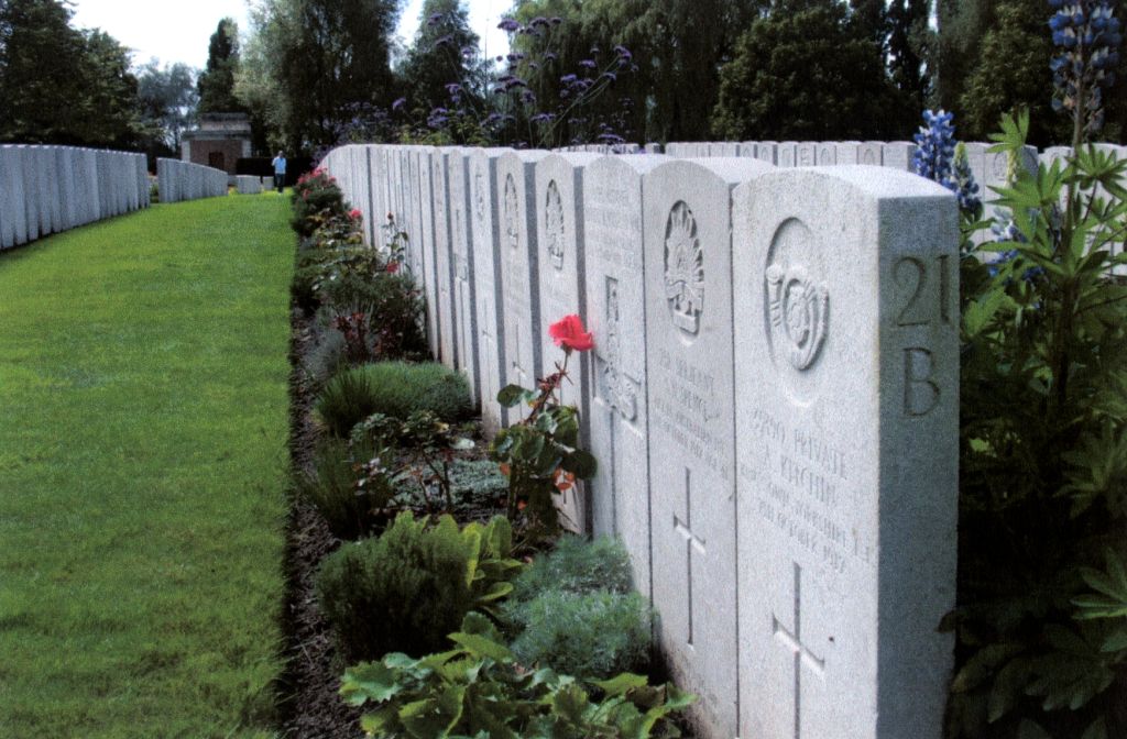 Lijssenthoek Military Cemetery with a row of gravestones