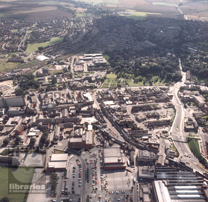 A colour aerial photograph of the town centre of Pontefract.  Chequerfield Estate is to the top left, the General Infirmary is in the centre and the dual carriageway, Jubilee Way, is centre right.  Dunhill's Liquorice Factory is bottom left.  Internal Reference: PO A128