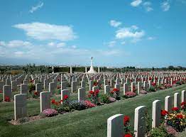 Catania War Cemetery with rows of graves under a blue sky